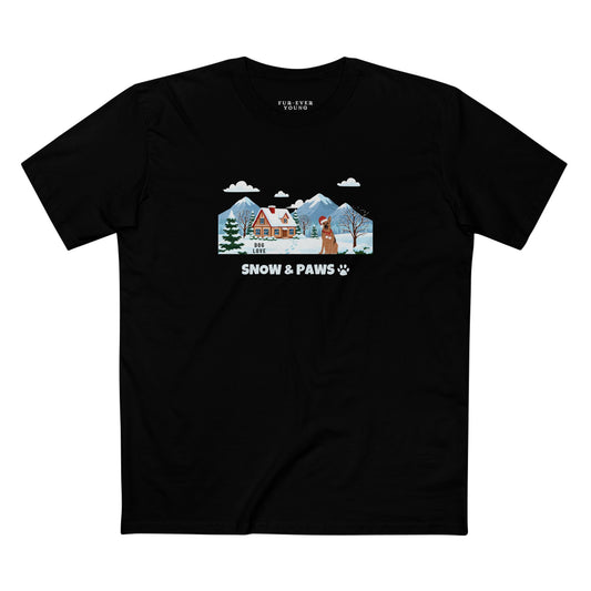 Black t-shirt with winter illustration featuring a German Shepherd, snowy house and mountains, “Snow & Paws” pet lover graphic tee